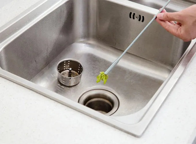 Flexible plastic and stainless steel drain cleaning spring tool with rubber grip for household pipe maintenance
