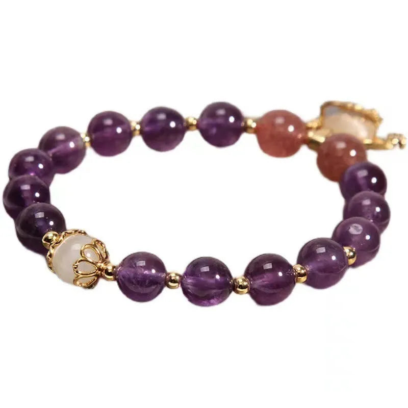 Handmade copper bracelet for women with a natural amethyst drop charm and longevity lock symbol.
