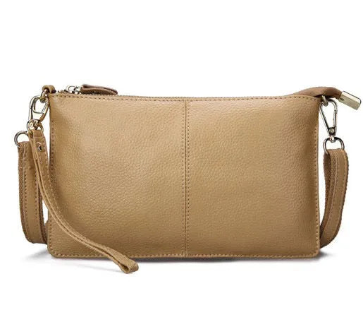 Lady cowhide slant handbag showing front compartment and adjustable shoulder strap in multiple colour options
