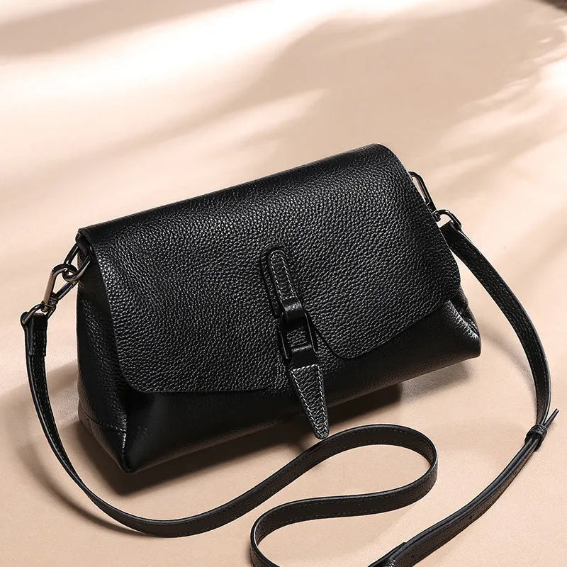 Women's soft first layer cowhide shoulder bag in black with adjustable strap and multiple pockets