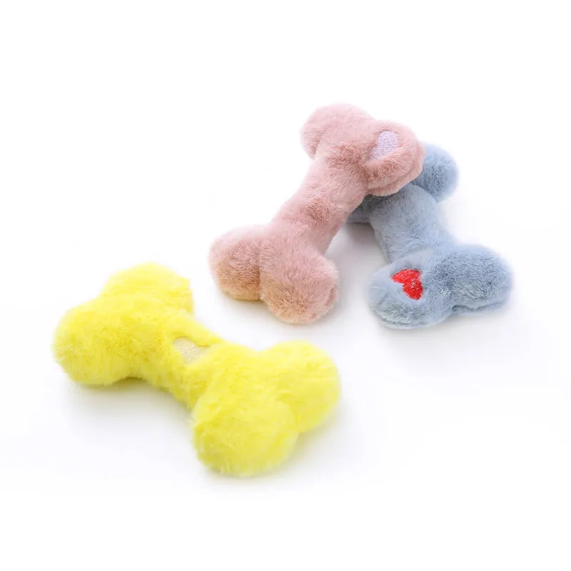 Bone-shaped plush dog toy with hearts and 'Love' text, containing squeaker for interactive pet play