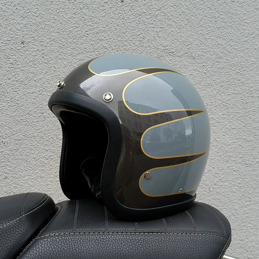 Retro-style open-face motorcycle half helmet in fibreglass, shown in a cement grey colour on a white background.