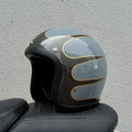 Retro-style open-face motorcycle half helmet in fibreglass, shown in a cement grey colour on a white background.