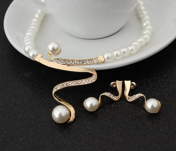 Gold electroplated pearl style necklace and earrings set with deep V clavicle design and drop pendant