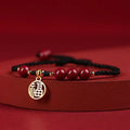 Cinnabar bracelet with braided rope and peach blossom charm for exam luck
