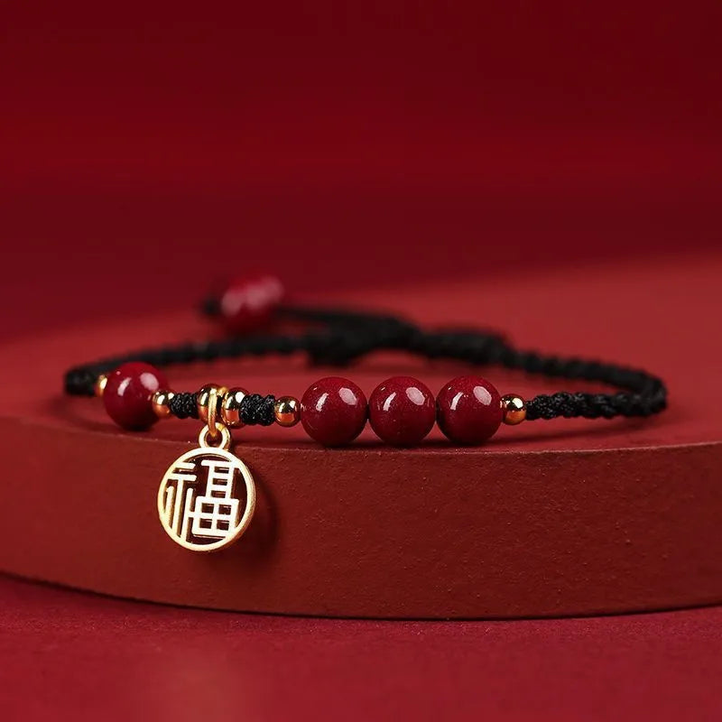 Cinnabar bracelet with braided rope and peach blossom charm for exam luck