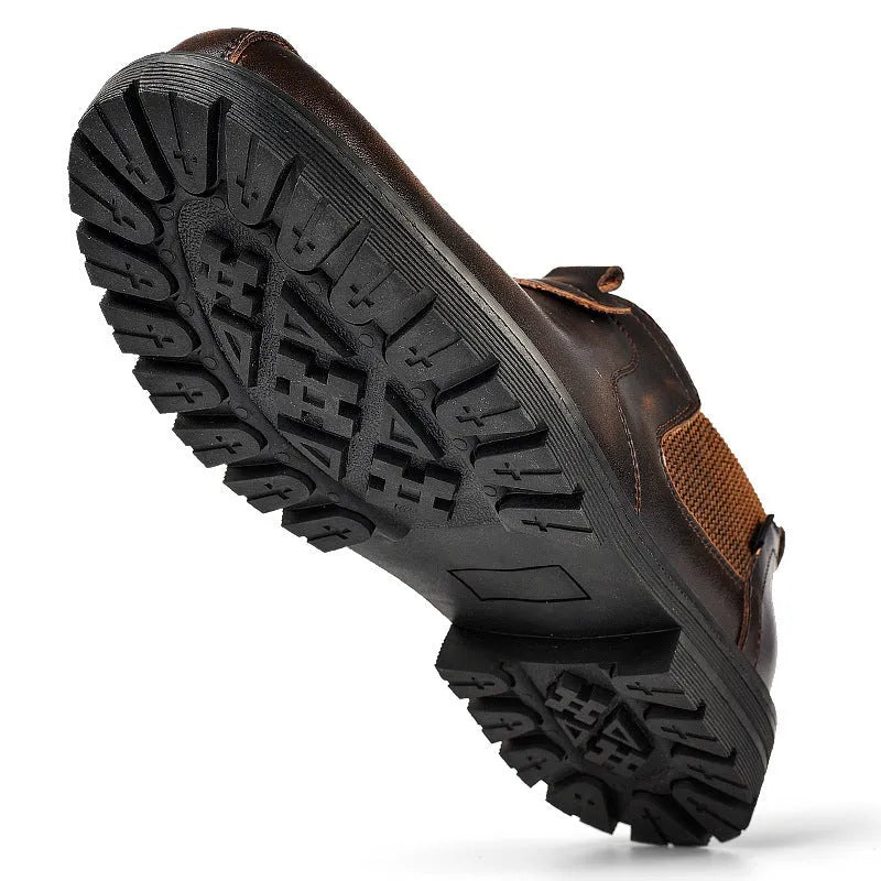 Men's black cowhide leather round toe loafers with rubber sole on a light background