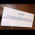 White Apple G6 Bluetooth wireless keyboard with ultra-thin metal casing.