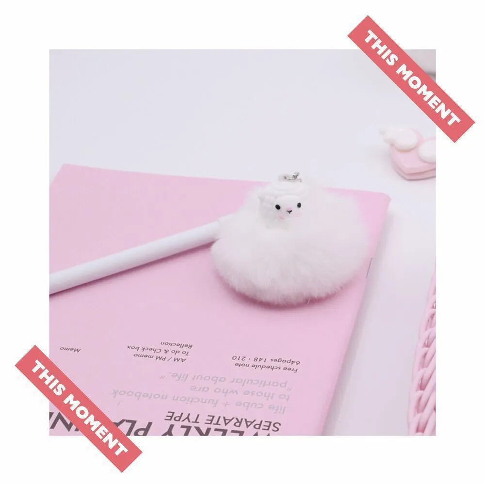 Alpaca hair ball pendant pen with neutral coloured barrel showing 0.5mm tip