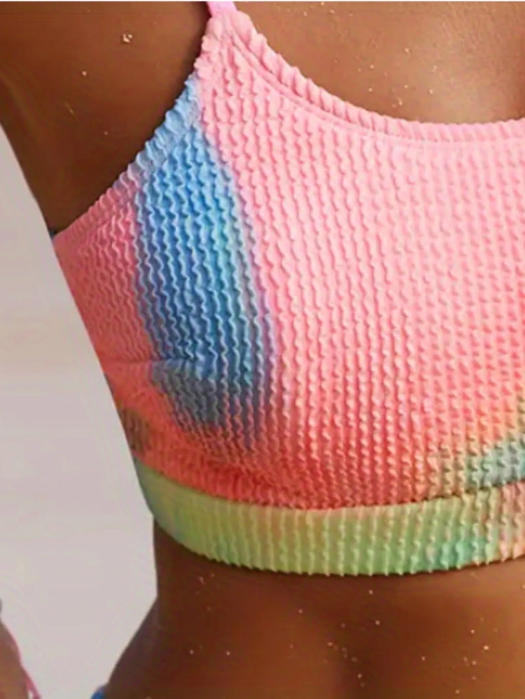 Women's blue and orange tie-dye pleated split bikini with gradient pattern on polyester fabric