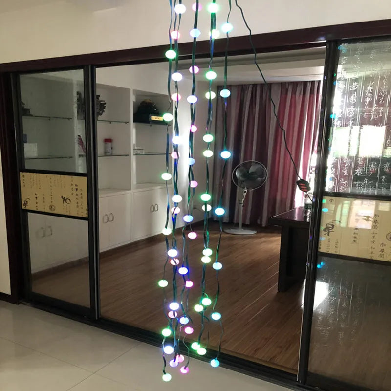 64 LED bead Christmas tree light string with button controller on a 1.8-metre cable.