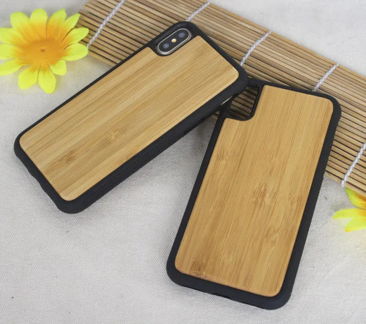 Wooden iPhone case with carbonized bamboo back and black TPU bumper, shown on an iPhone.