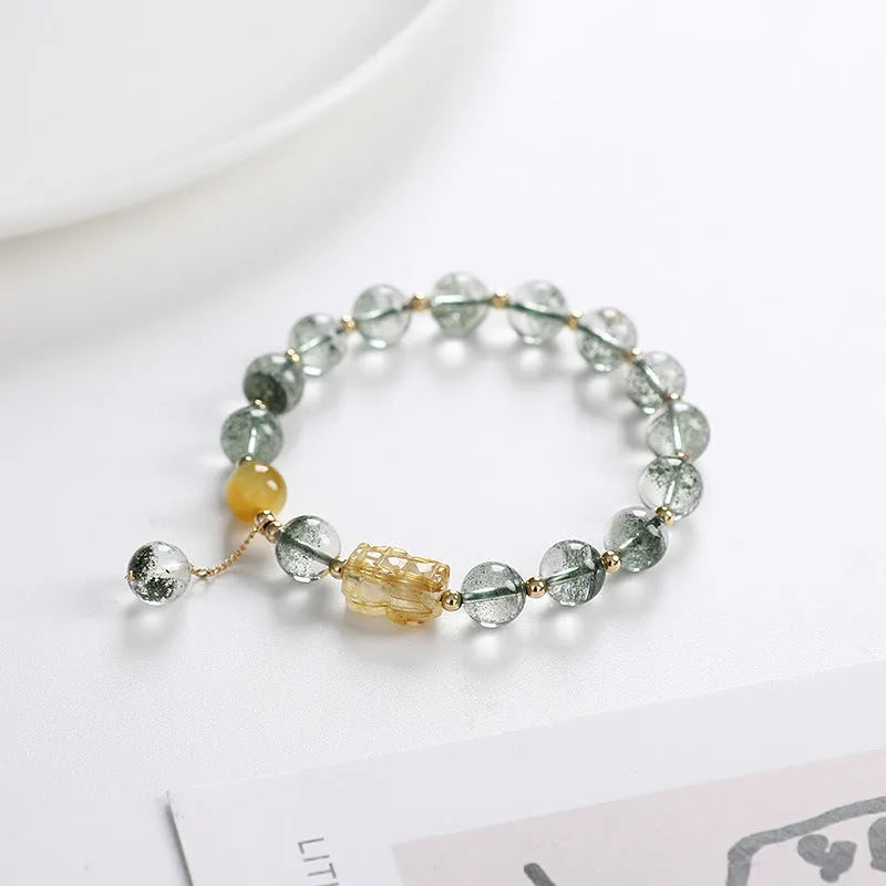 Green phantom quartz crystal bracelet with 8mm geometric beads and gold rutile inclusions