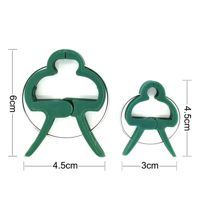 Green plastic and zinc plant fixing clips, showing large and small sizes for climbing vegetables.