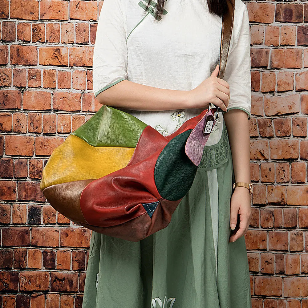 Cowhide leather travel document bag with stitching details and crossbody shoulder strap