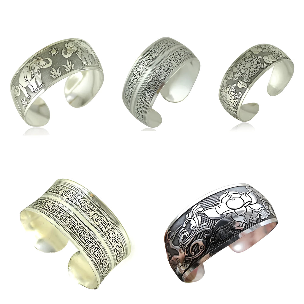 Open design Miao ethnic bracelet in silver alloy with carved turtle or elephant motif.