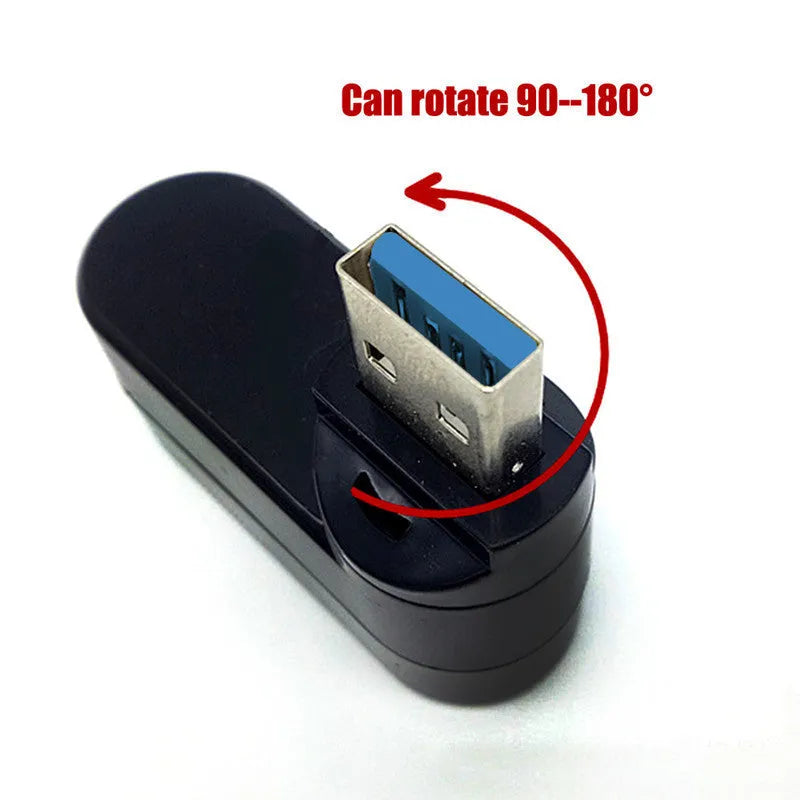 Black USB rotary splitter hub with four USB 3.0 ports on a white desk.