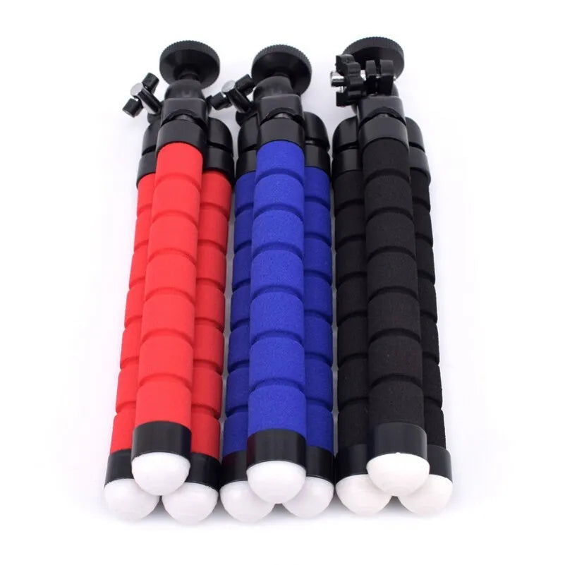 Black flexible octopus tripod wrapped around pole holding smartphone for video recording
