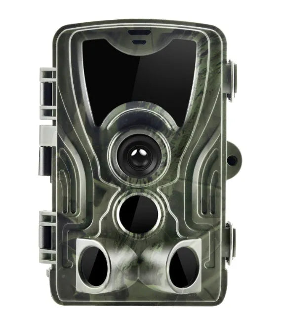 Green cellular trail hunting camera showing front lens and display on a tree mount.