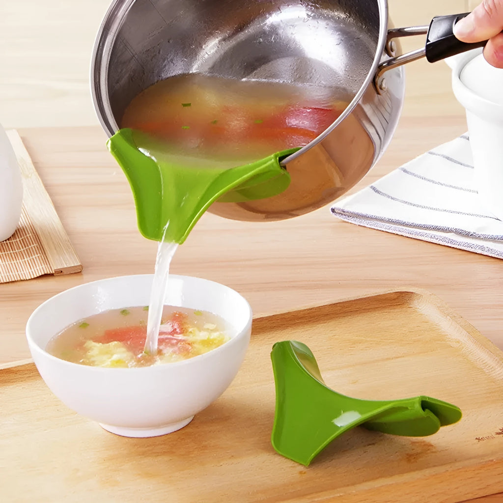 Green silicone kitchen funnel with clamp for round pots on kitchen counter
