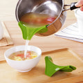 Green silicone kitchen funnel with clamp for round pots on kitchen counter