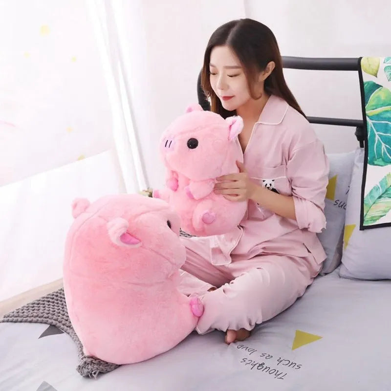 Brown boba milk tea plushie soft toy shaped like a cup with fruit, sitting as a cushion.