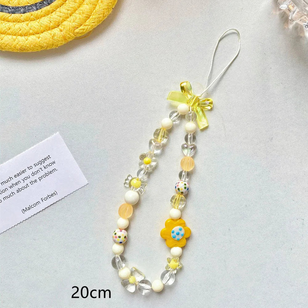Beaded flower mobile phone lanyard in yellow, blue and pink colour options with plastic resin construction