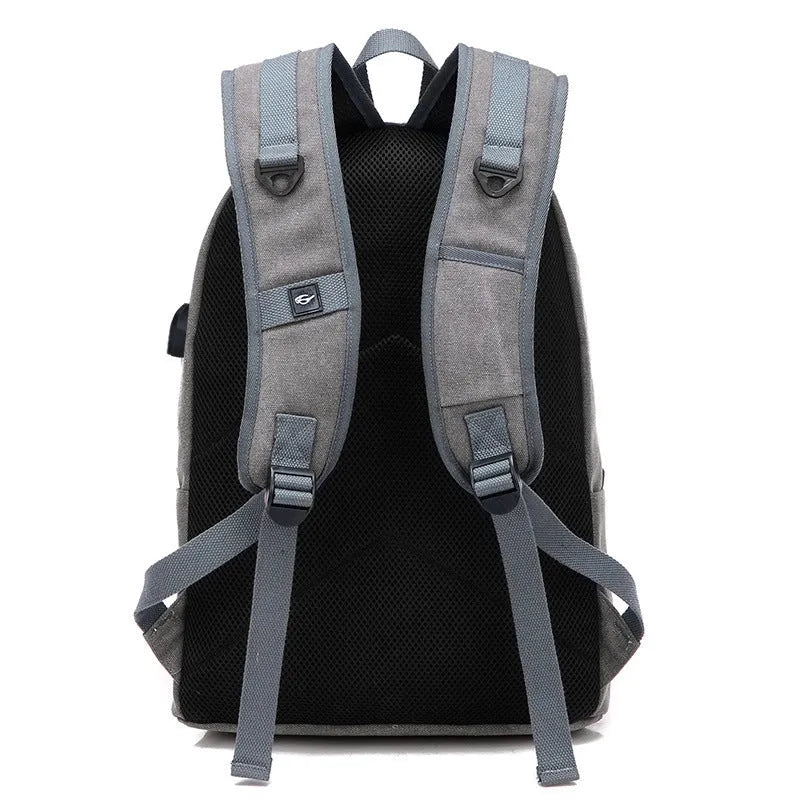 Canvas backpack with USB charging port showing coffee, grey, khaki, and black colour options