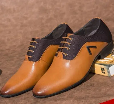 Men's black Oxford-style lace-up shoes with a low upper and rubber sole for business casual wear.