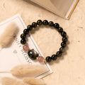Black obsidian bracelet with 8mm beads and silver cat charms on stretch cord