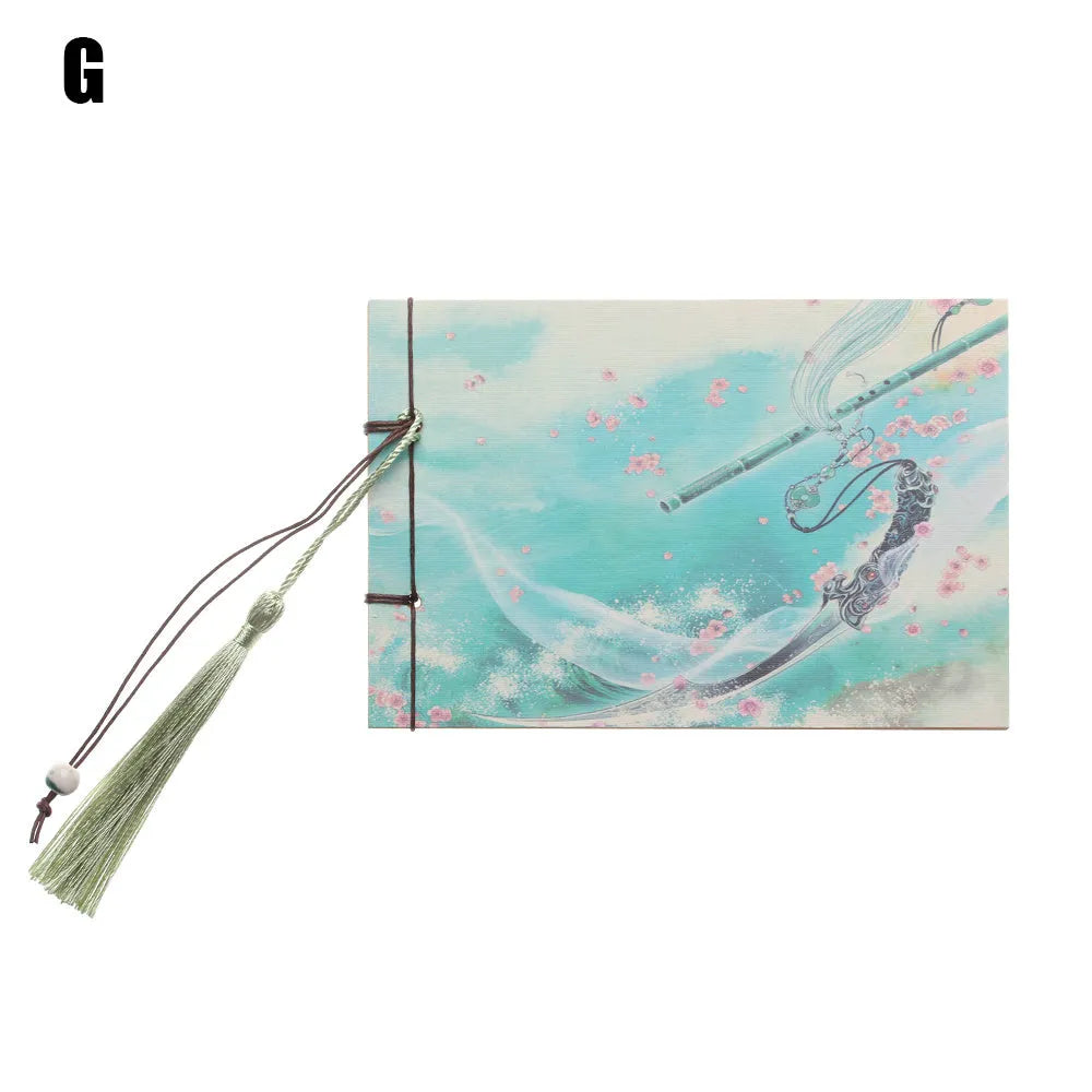 Kraft paper notebook with tassel bookmark showing hand-stitched binding and blank interior pages