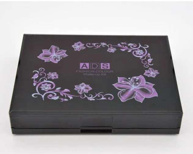 Three-layer makeup box with 24 colour eyeshadows, 8 lipsticks, blushes, powders, brushes, and mirror
