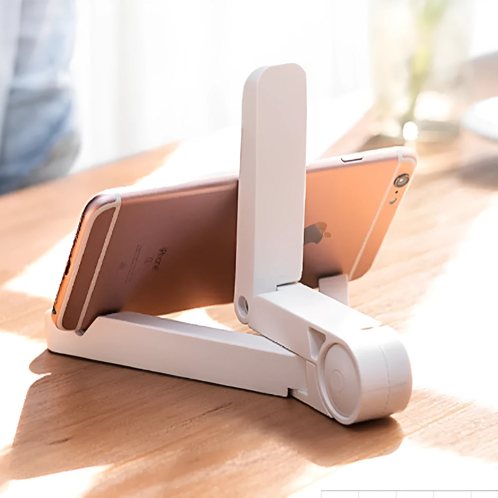Black foldable tablet holder displaying adjustable angles with phone in landscape mode on non-slip surface