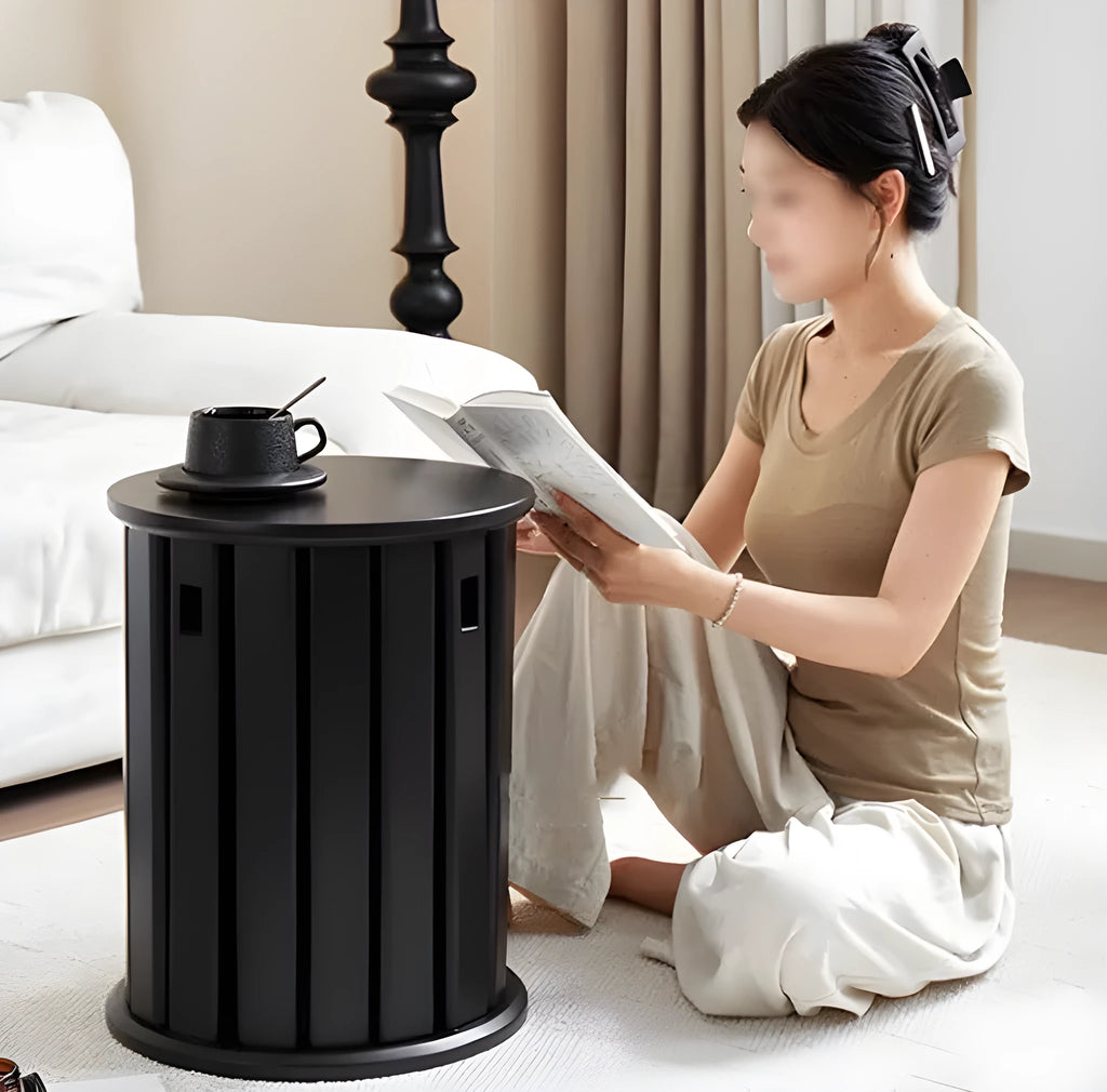 Stackable round iron dining stool in a modern style, shown in one of four available colours.