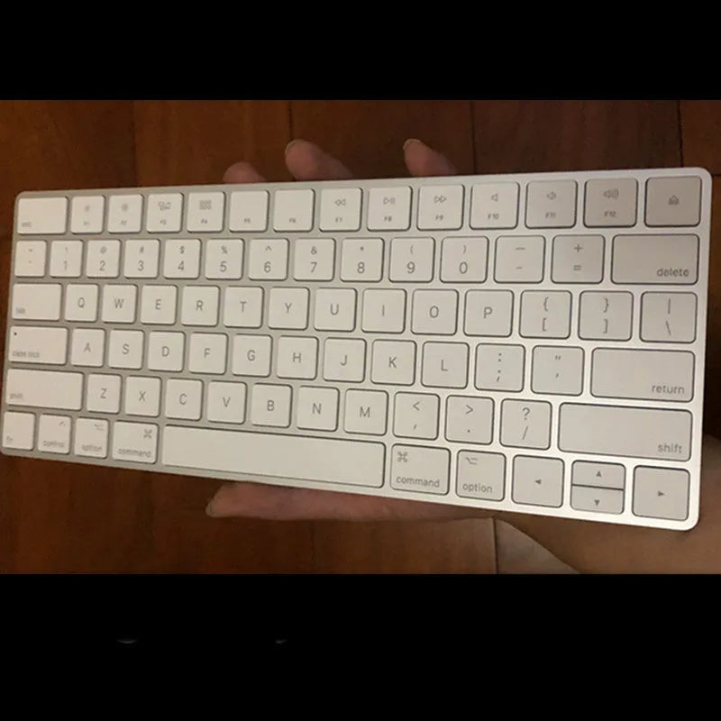 White Apple G6 Bluetooth wireless keyboard with ultra-thin metal casing.