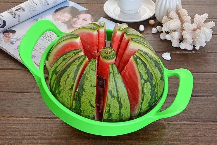 Green plastic melon slicer with stainless steel blades cutting a watermelon into wedges.
