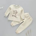 Infant warmer suit in natural coloured cotton with trousers style and cartoon stripe pattern