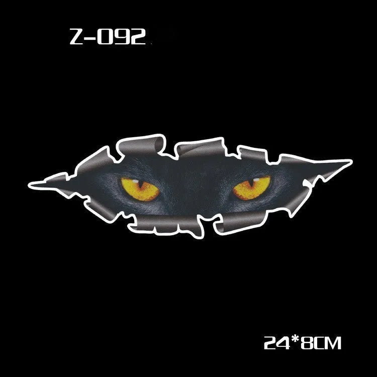 Pair of reflective cartoon car stickers with cute eye designs on a white background.
