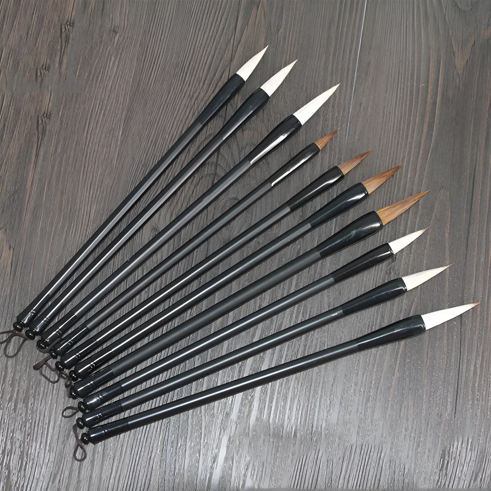 Traditional Chinese student writing brush with Jianhao nib on steel pipe barrel measuring 23cm length