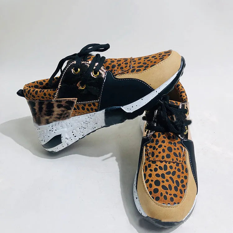 Women's suede casual sneakers with a wedge sole in leopard print colour.