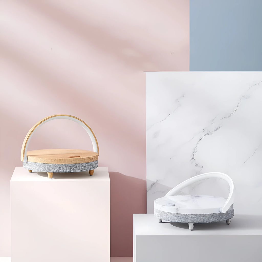 Wireless charging LED night light with Bluetooth speaker and phone holder in marble pattern finish.