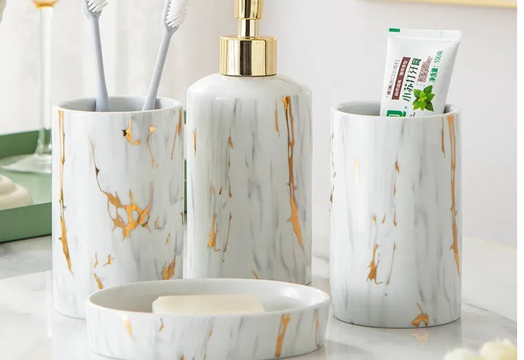 White ceramic bathroom wash set with two cups, latex bottle and soap box in gift packaging