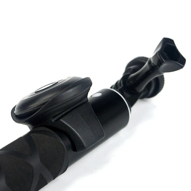 Black Bluetooth remote control for selfies with snap magnetic attachment showing compact design