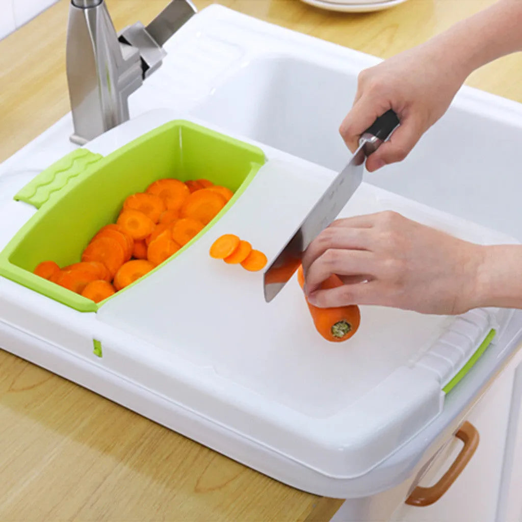 Green multi-function cutting board with sink basket mounted on kitchen sink edge