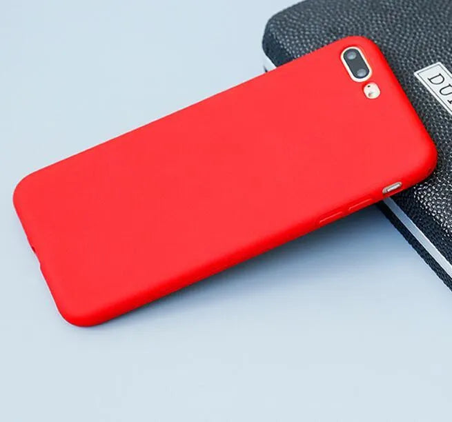 Frosted matte soft phone case for Apple iPhone models on a table.