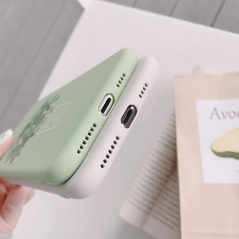 White silicone iPhone case with painted plant design showing 360-degree edge protection
