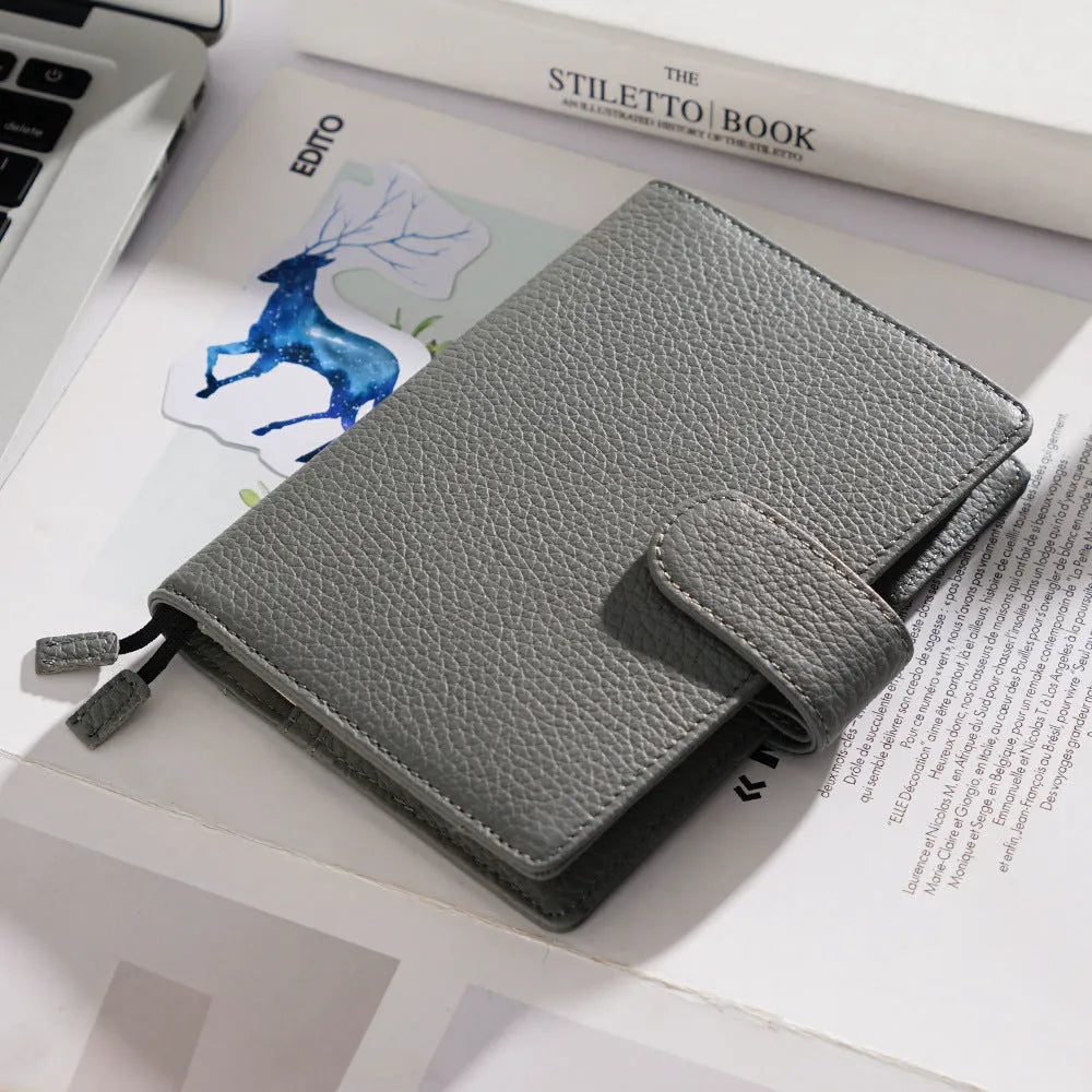 A6 size leather loose-leaf diary with a textured lychee pattern cowhide cover