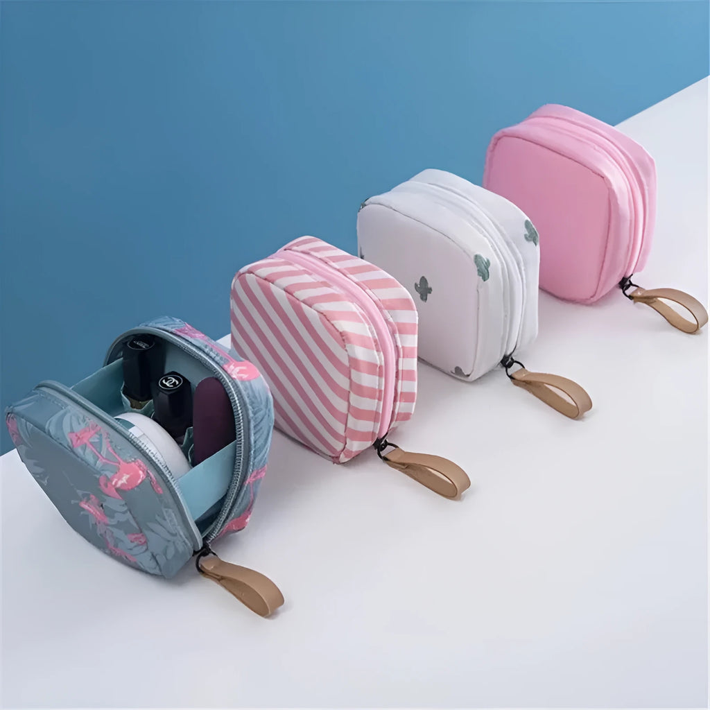 A cube-shaped cloth makeup storage bag in a selection of colours including blue, pink, white, and white pink.