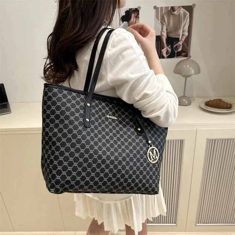 Western style black PU leather shoulder bag with adjustable strap and sewing thread detail.