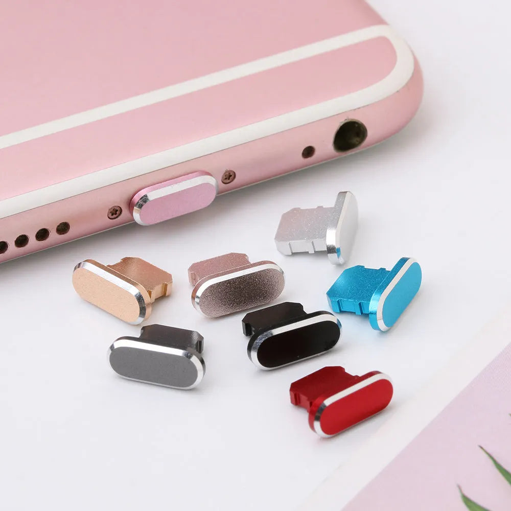 Aluminium alloy mobile phone charging port dust plug for iPhone, shown in multiple colours.